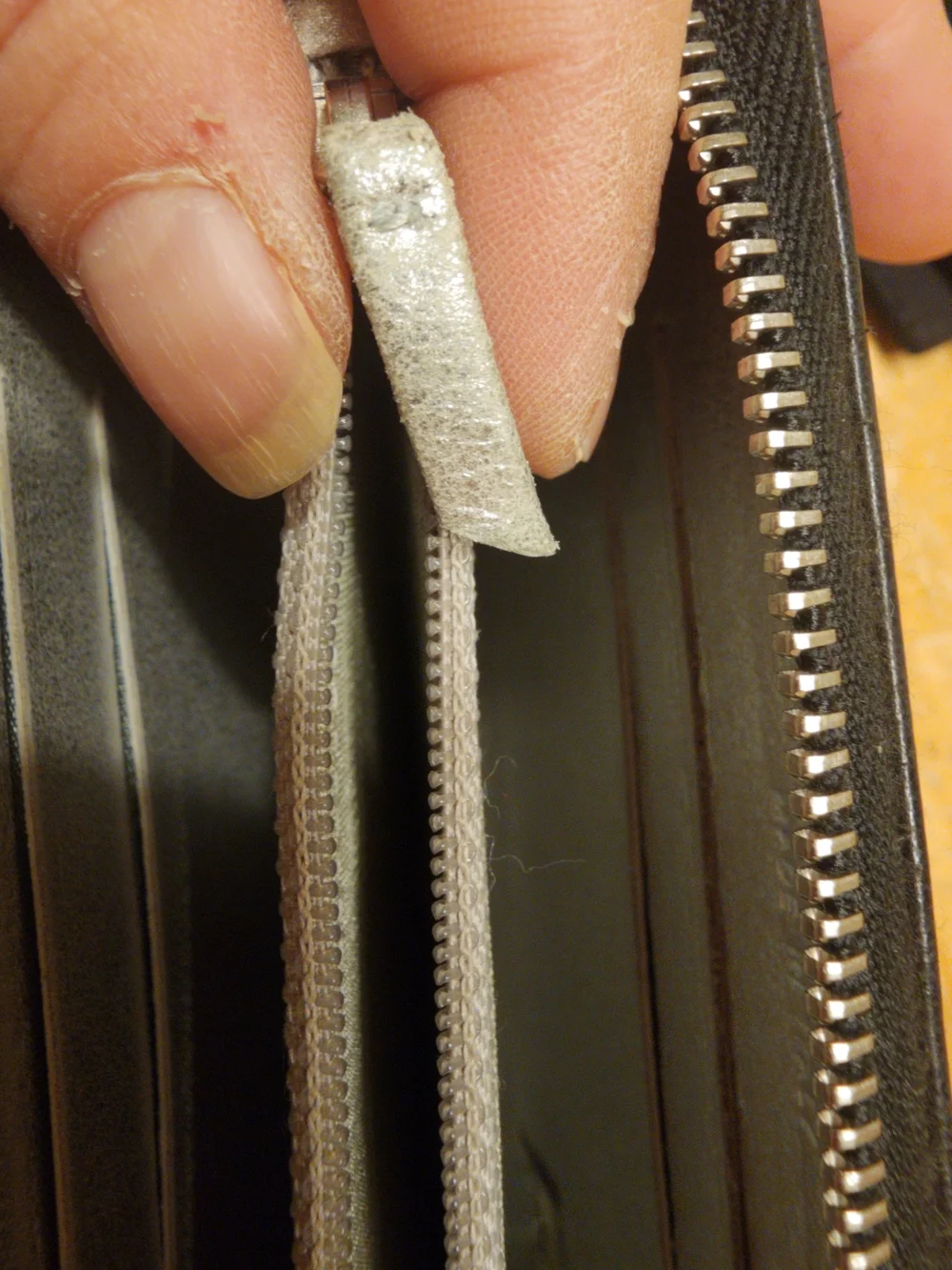 Chanel Timeless CC zip-around wallet features smooth black leather